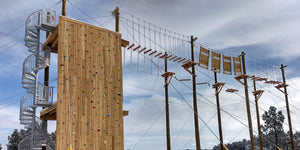 Challenge course with high elements, ropes course, and climbing wall designed and built by ABEE Inc. in Colorado.
