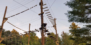 Aerial, canopy challenge course with high ropes, platforms, and plank bridges designed and built by ABEE Inc. in Sandstone, Minnesota.