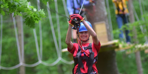 Challenge course with high elements, ropes course, and climbing wall designed and built by ABEE Inc. in Colorado.