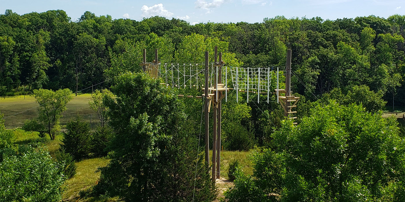 Aerial, canopy rope bridge challenge course with platforms designed and built by ABEE Inc. in Lakeville, Minnesota.